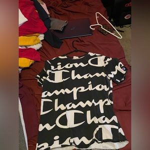Champion shirt with the words champion all over slightly used